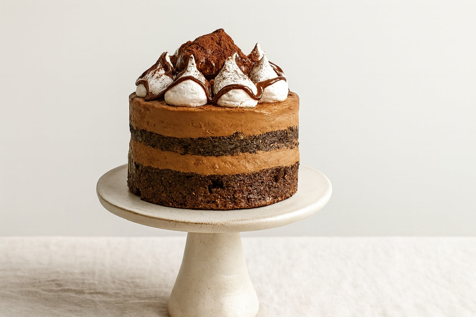 Dello Mano handmade Chocolate Milkshake Mud Cake with Belgian chocolate layers and milkshake buttercream.