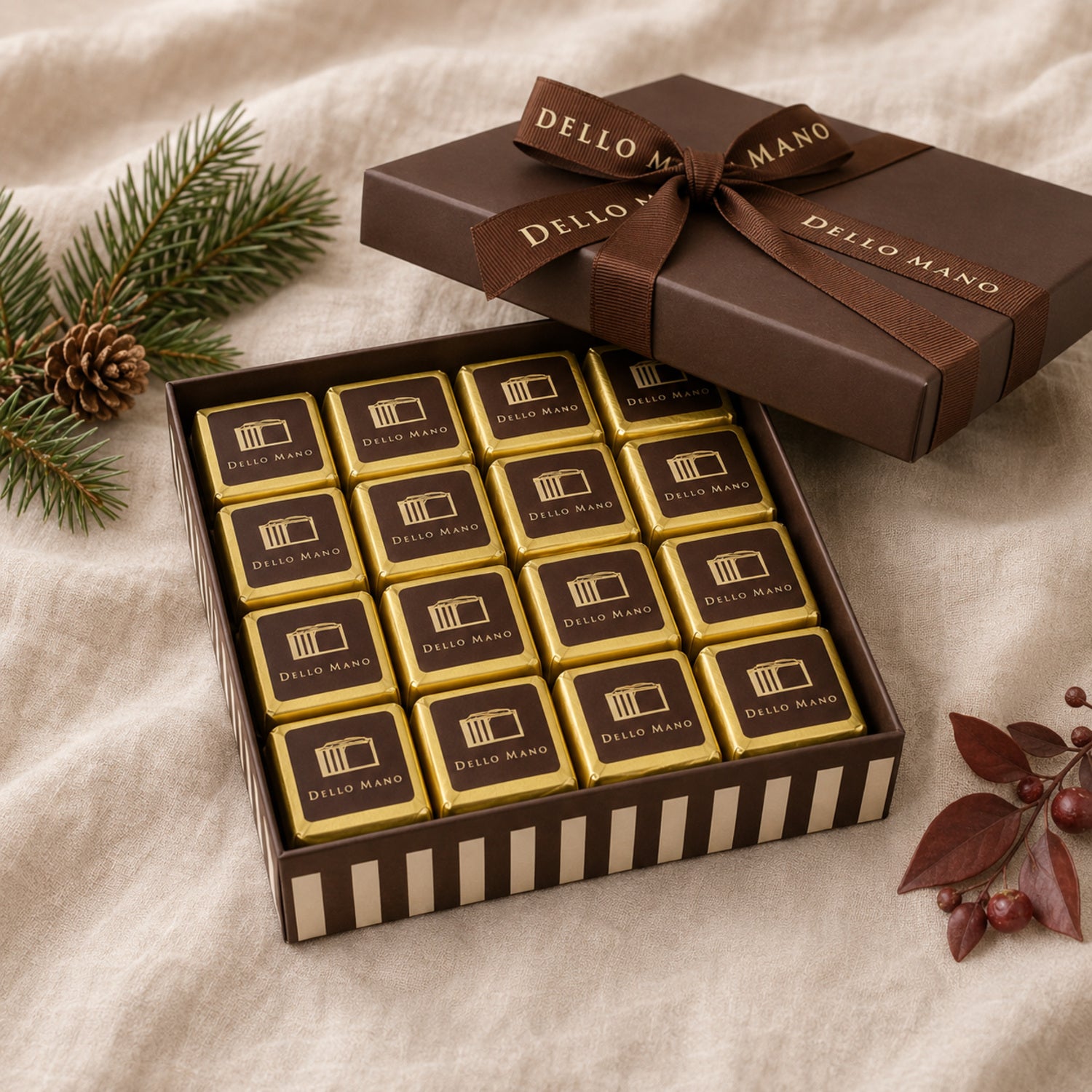 Open Dello Mano corporate Christmas brownie gift box with 16 individually wrapped brownies and branded ribbon