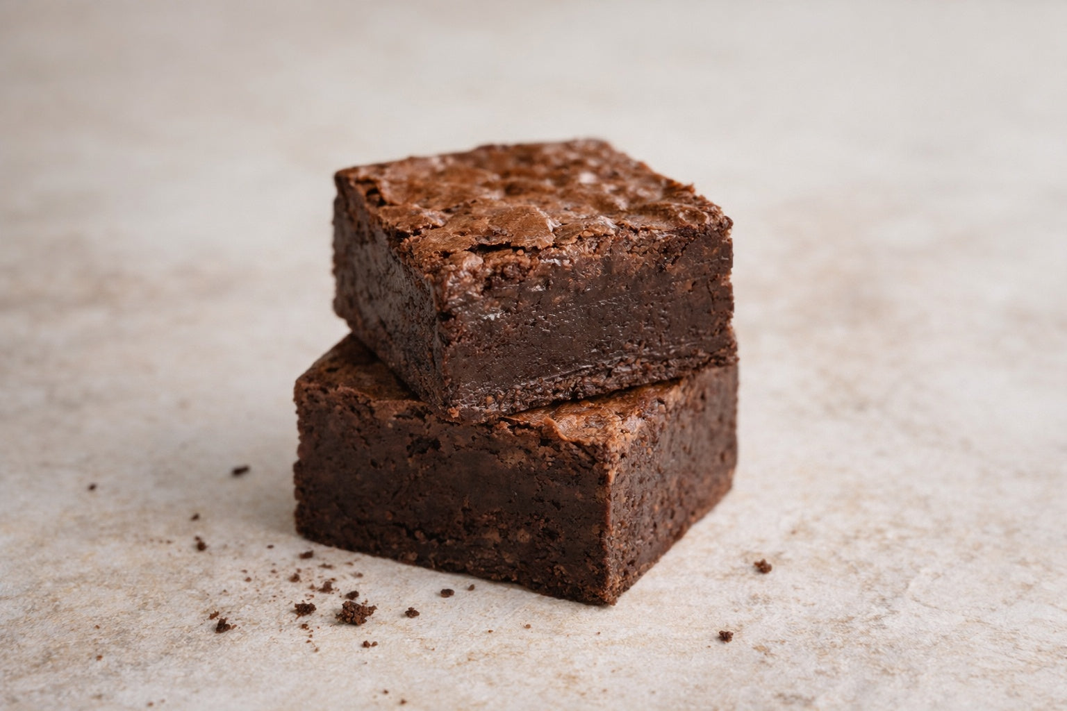 Close-up of a handmade chocolate brownie showing fudgy texture and crackled top