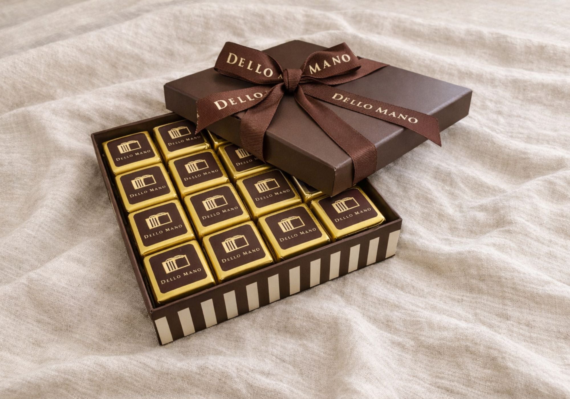 Premium chocolate gift box with gold foil wrapped brownies by Dello Mano