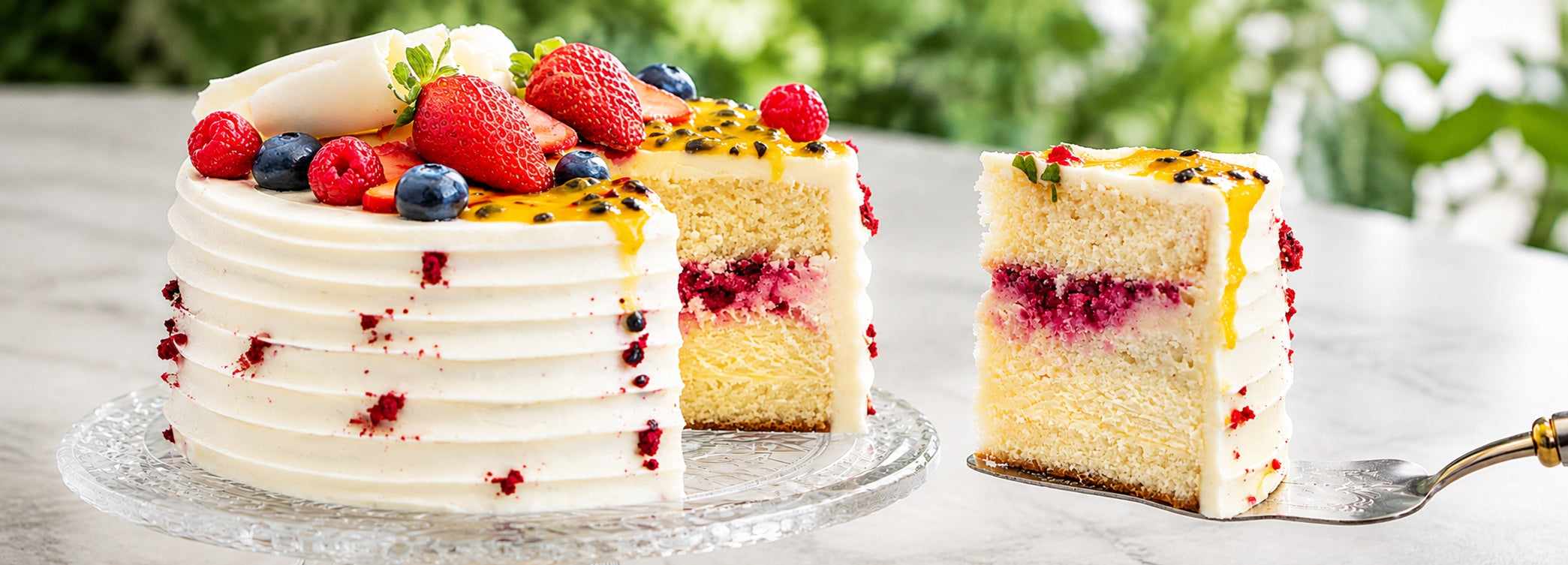 Close-up of a handmade Dello Mano cake slice showing layers, texture and filling