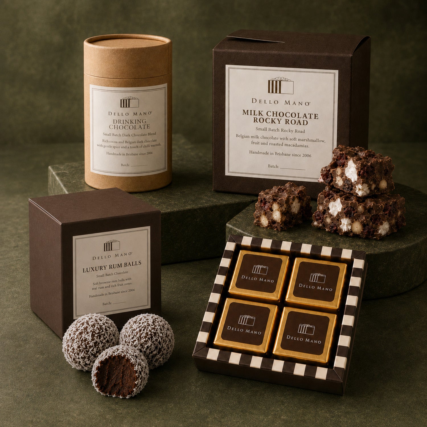 Dello Mano chocolate gifts with Luxury Brownies, drinking chocolate, rocky road and rum balls in cube-shaped packaging.
