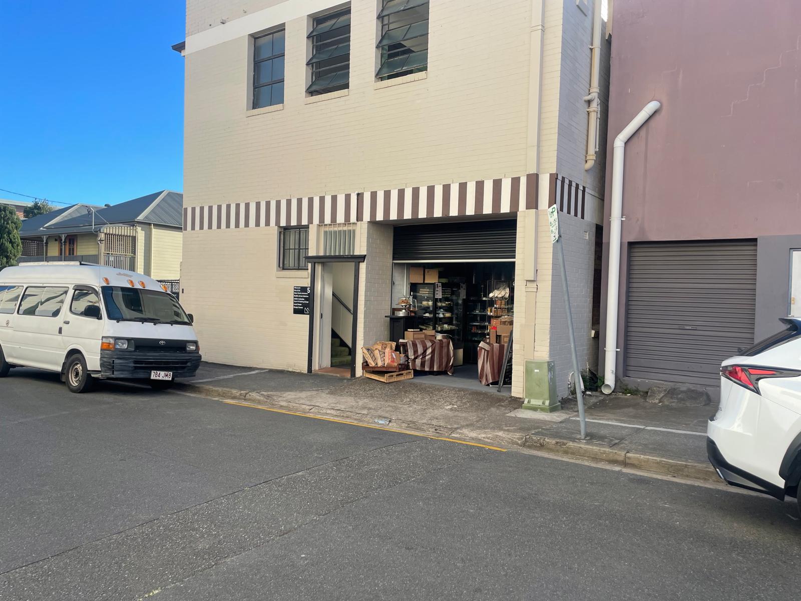 Commercial Dello Mano kitchen with a striped awning and kitchen store for sale and click and collect.