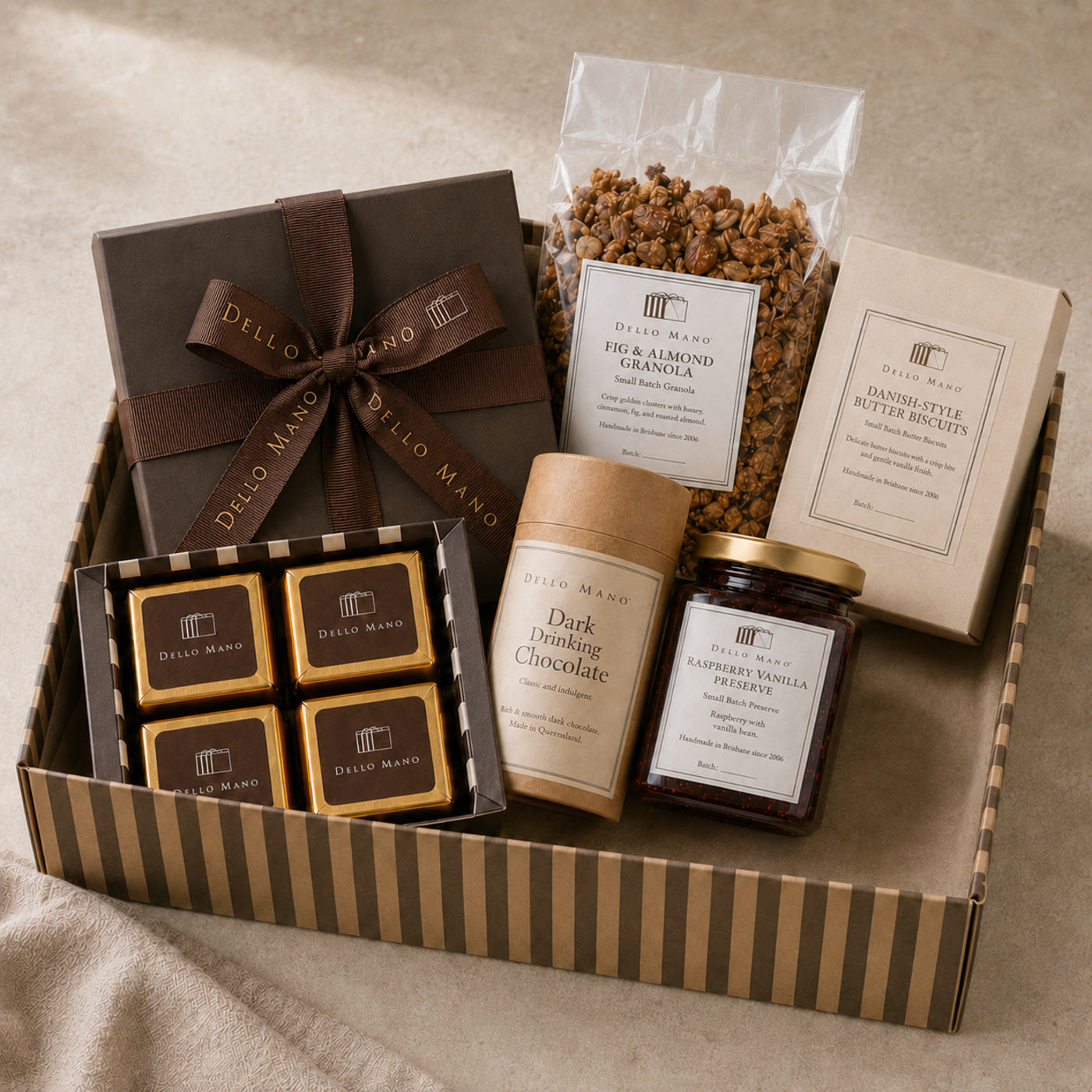 Premium Dello Mano corporate hamper with Belgian chocolate brownies, biscuits, granola, preserve and drinking chocolate.