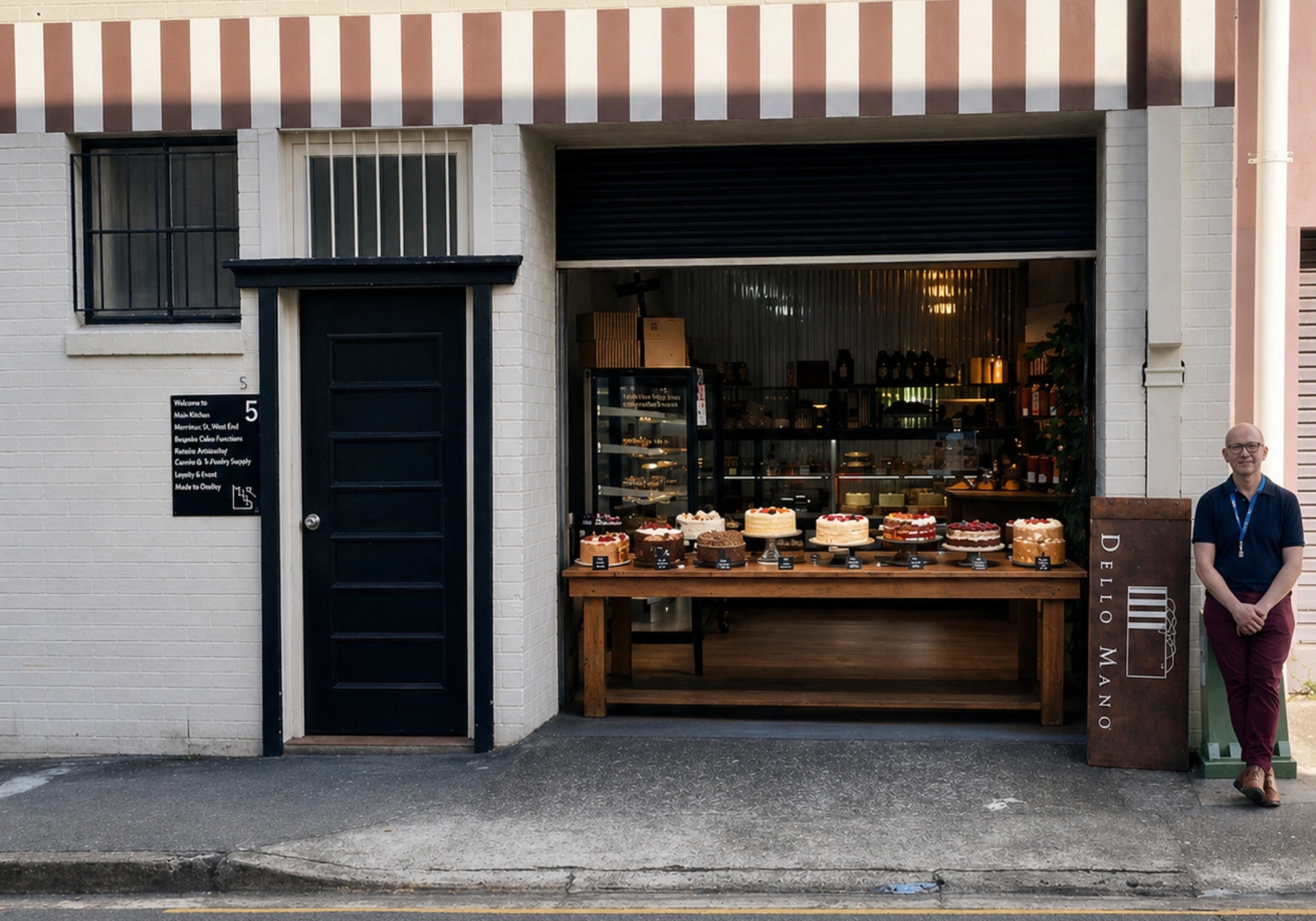 Dello Mano Brisbane cake shop storefront with handmade cakes displayed on wooden table for pickup