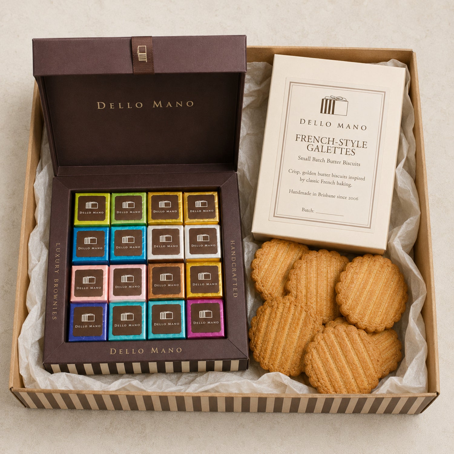 Dello Mano team hamper with a 16-piece coloured brownie gift box and tumble-packed French-style galettes for office sharing.