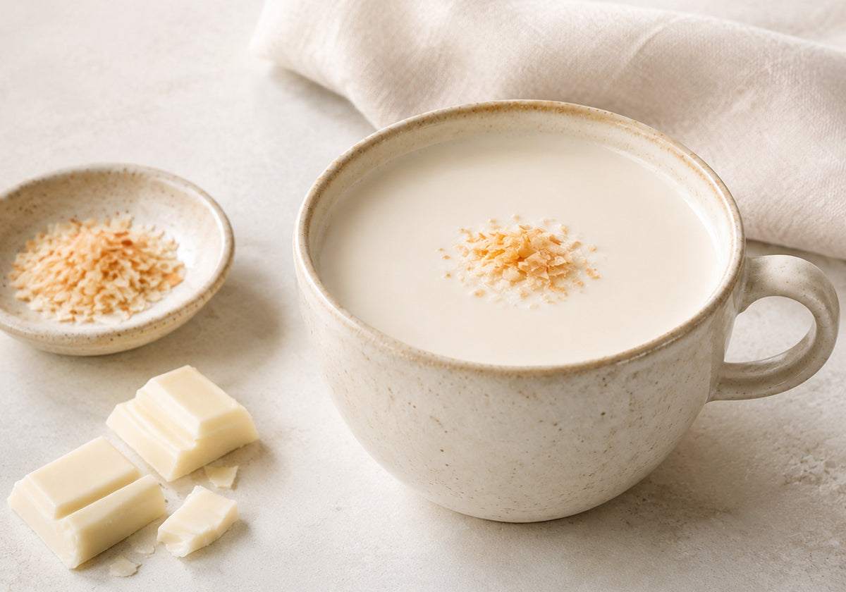 Creamy white chocolate drinking chocolate topped with golden toasted coconut
