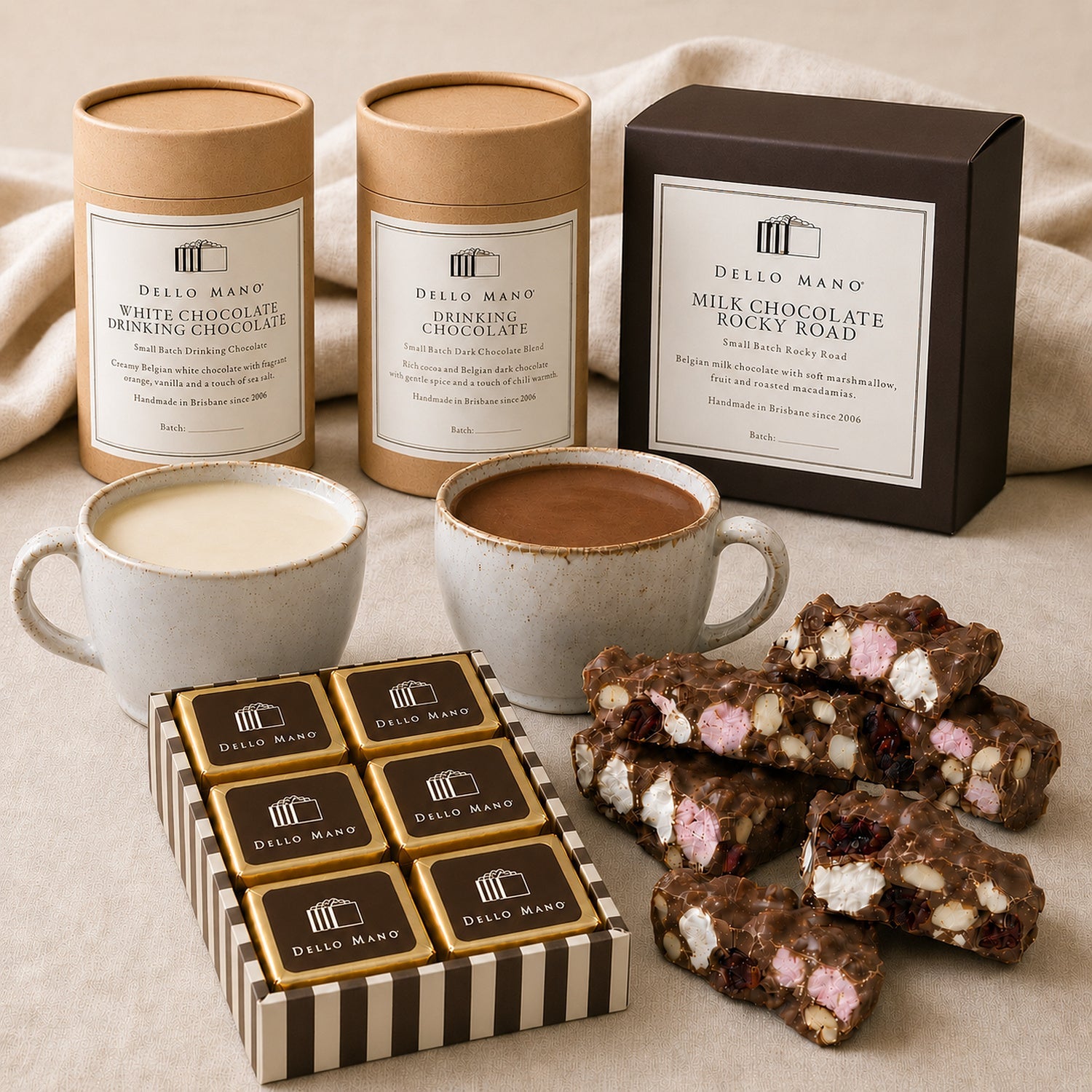 Open Dello Mano Chocolate Moments Hamper with two drinking chocolates, six Classic brownies and Milk Chocolate Rocky Road.
