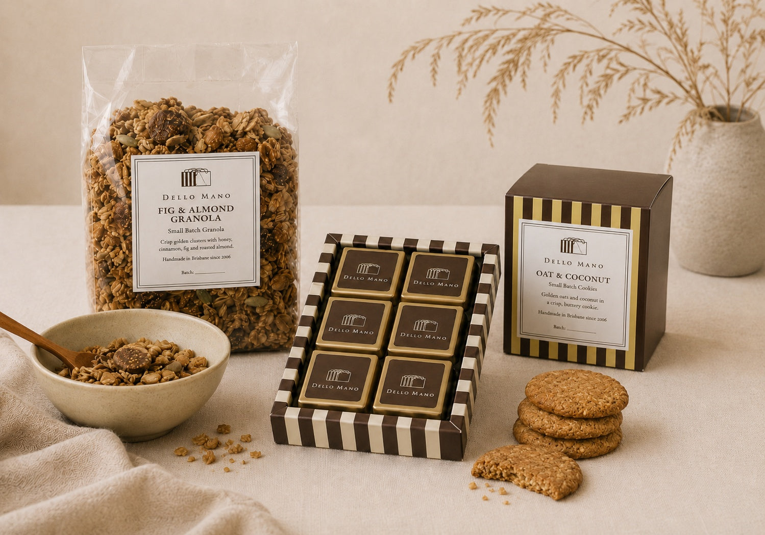 The Thoughtful Treat Hamper by Dello Mano with handmade brownies, oat and coconut cookies, and fig and almond granola styled in a calm gift setting.