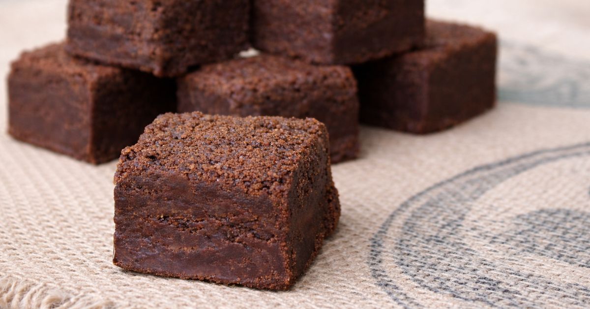 close up chocolate brownies showing dense fudgy texture and structured crumb for delivery stability