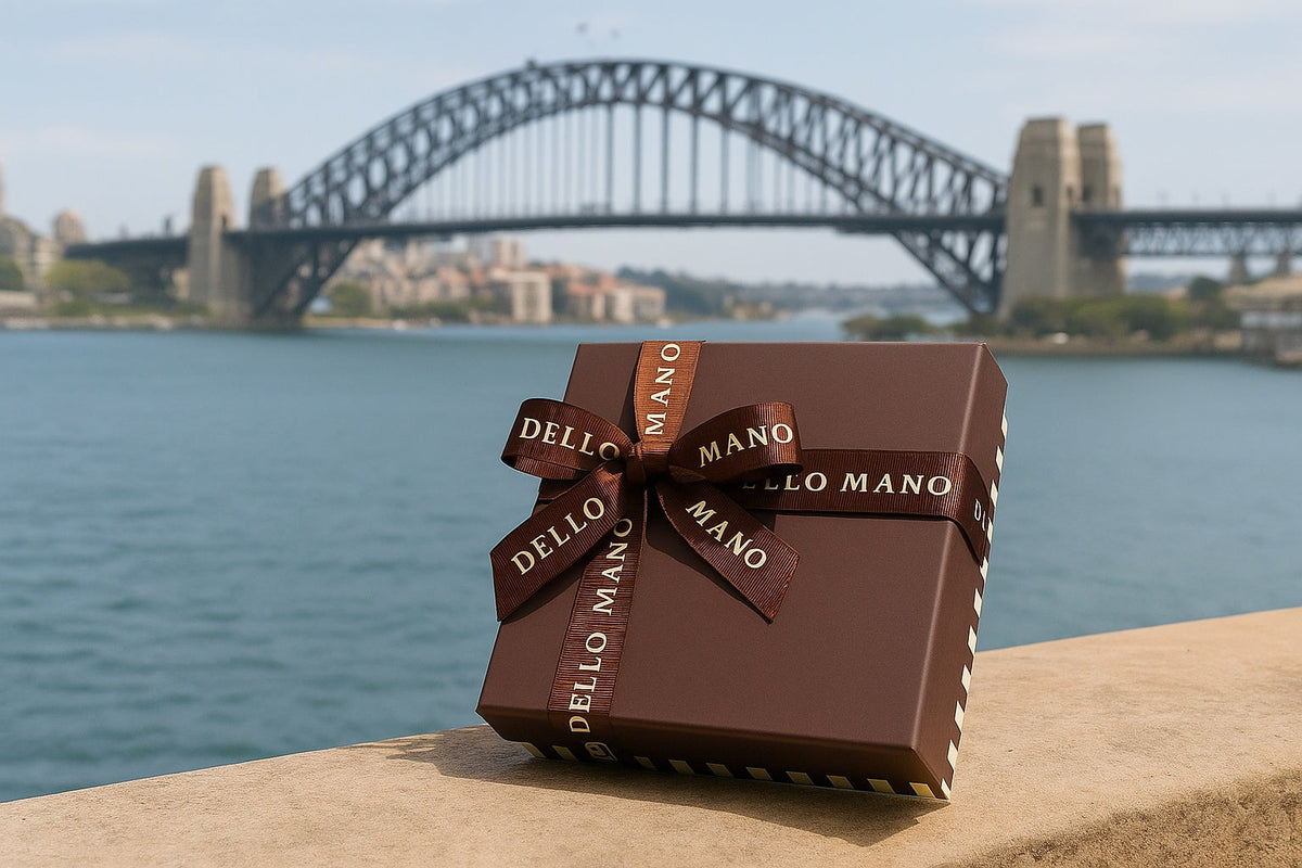 Dello Mano handmade brownie delivery Sydney – luxury gift box near Sydney Harbour Bridge, tied with grosgrain ribbon.