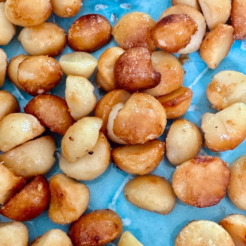 Caramelised macadamia nuts cooling after small batch roasting at Dello Mano.