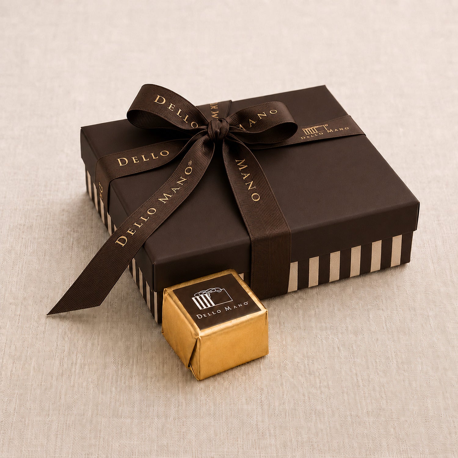 Dello Mano Luxury Brownie Gift Box with gold foiled brownie cube in front.