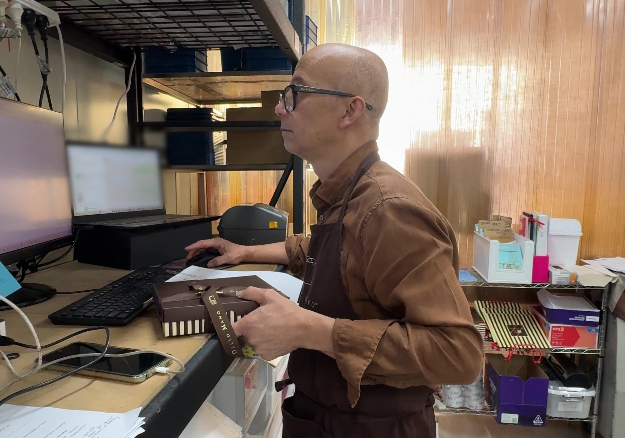 Bien Peralta booking a corporate gift order at the Dello Mano dispatch desk