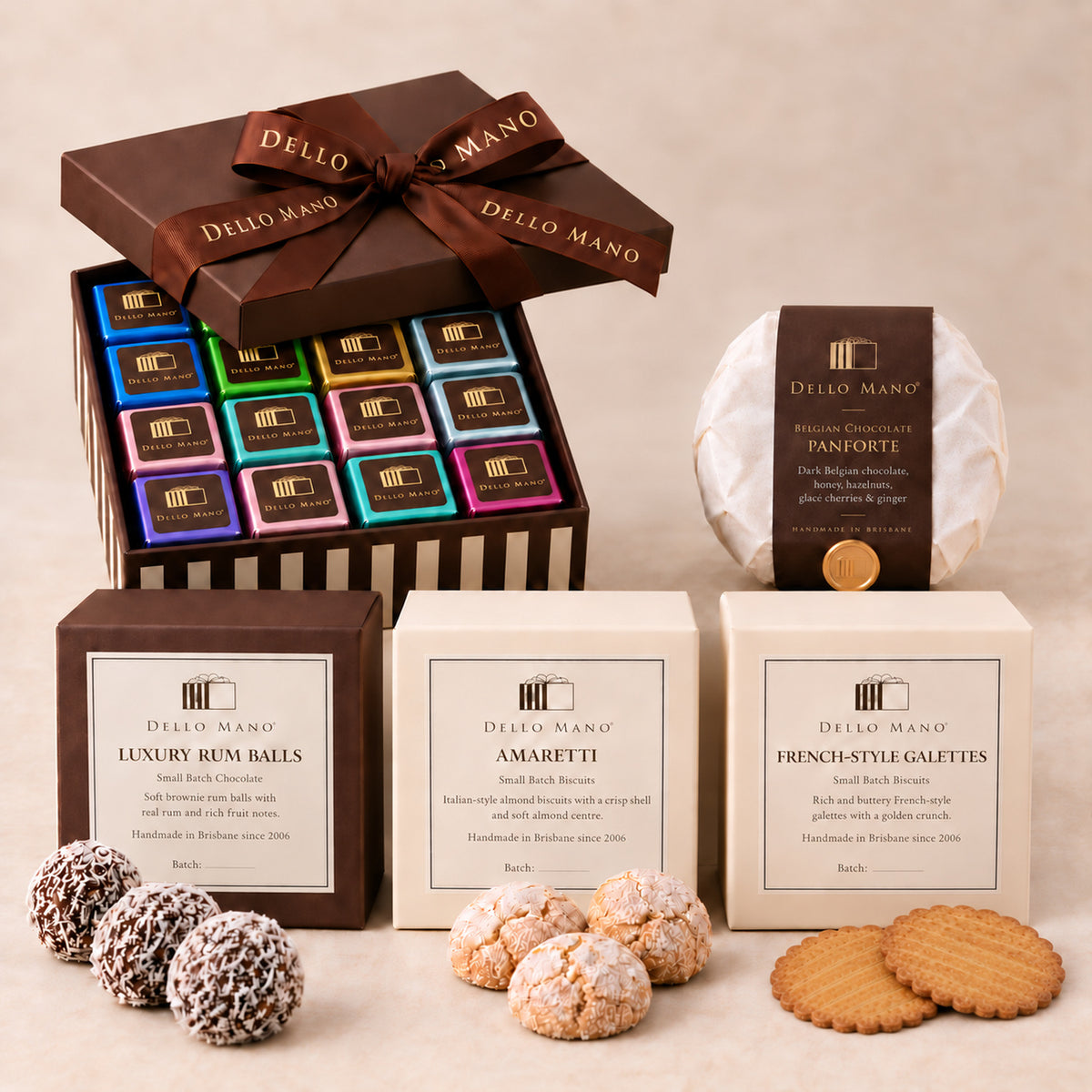 Dello Mano Christmas Indulgence Hamper with a 16-piece mixed brownie gift box, panforte, rum balls, amaretti and thin French galettes.