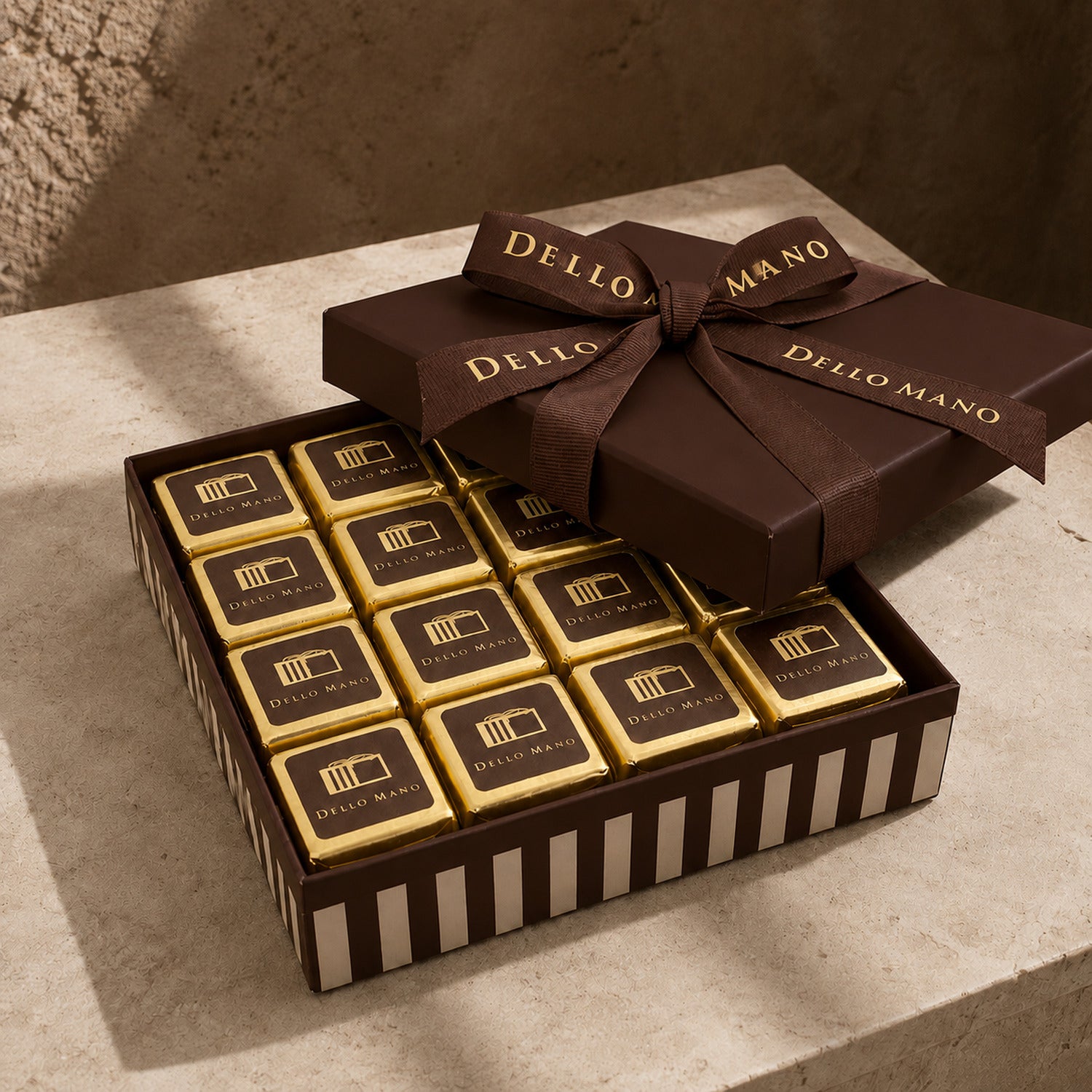 Dello Mano handmade brownie gift box with individually wrapped Luxury Brownies and rich chocolate-brown presentation packaging.