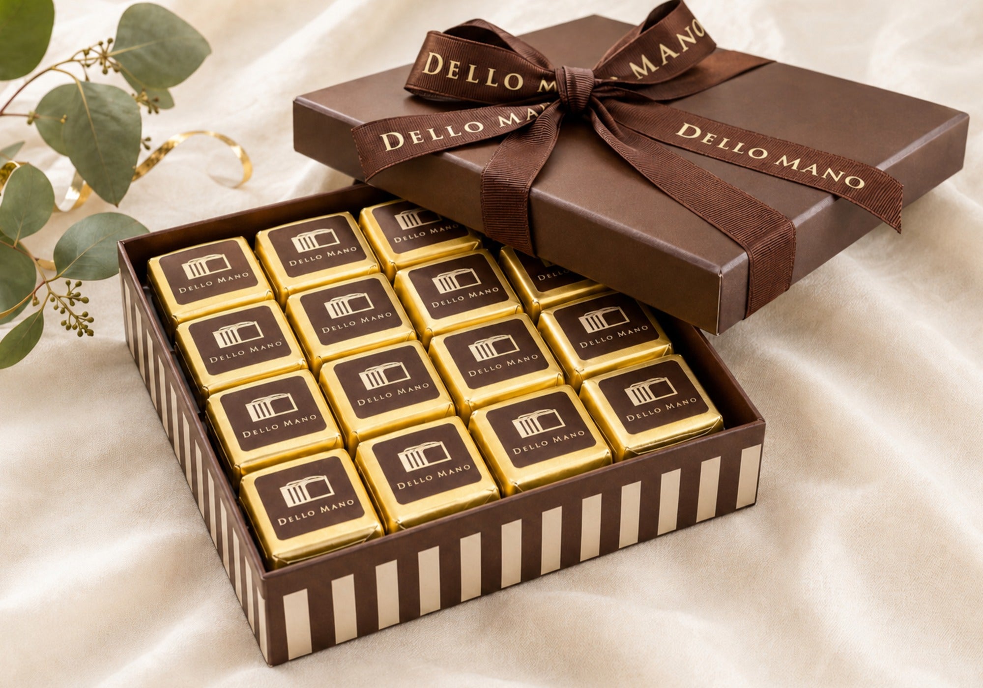 Open Dello Mano corporate brownie gift box with individually wrapped brownies ready to share