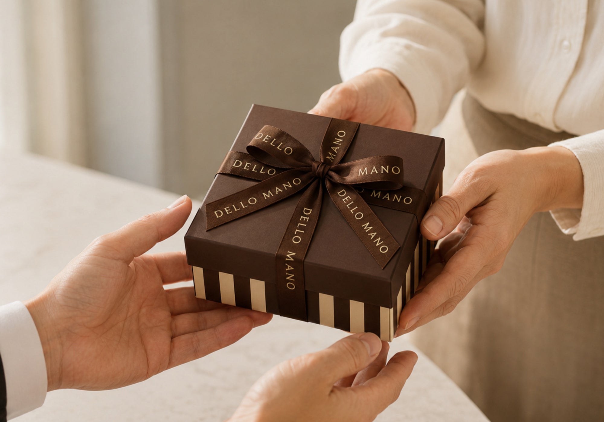 Dello Mano handmade corporate gift box being presented to a business recipient.