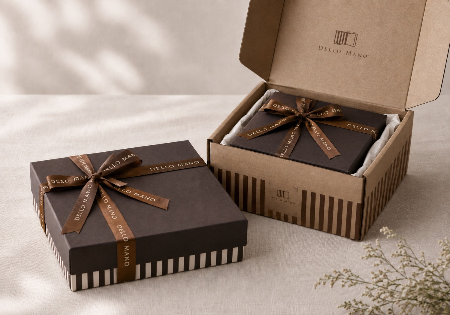 Dello Mano chocolate gift box packed snugly inside a striped cardboard dispatch box for Australia-wide delivery.