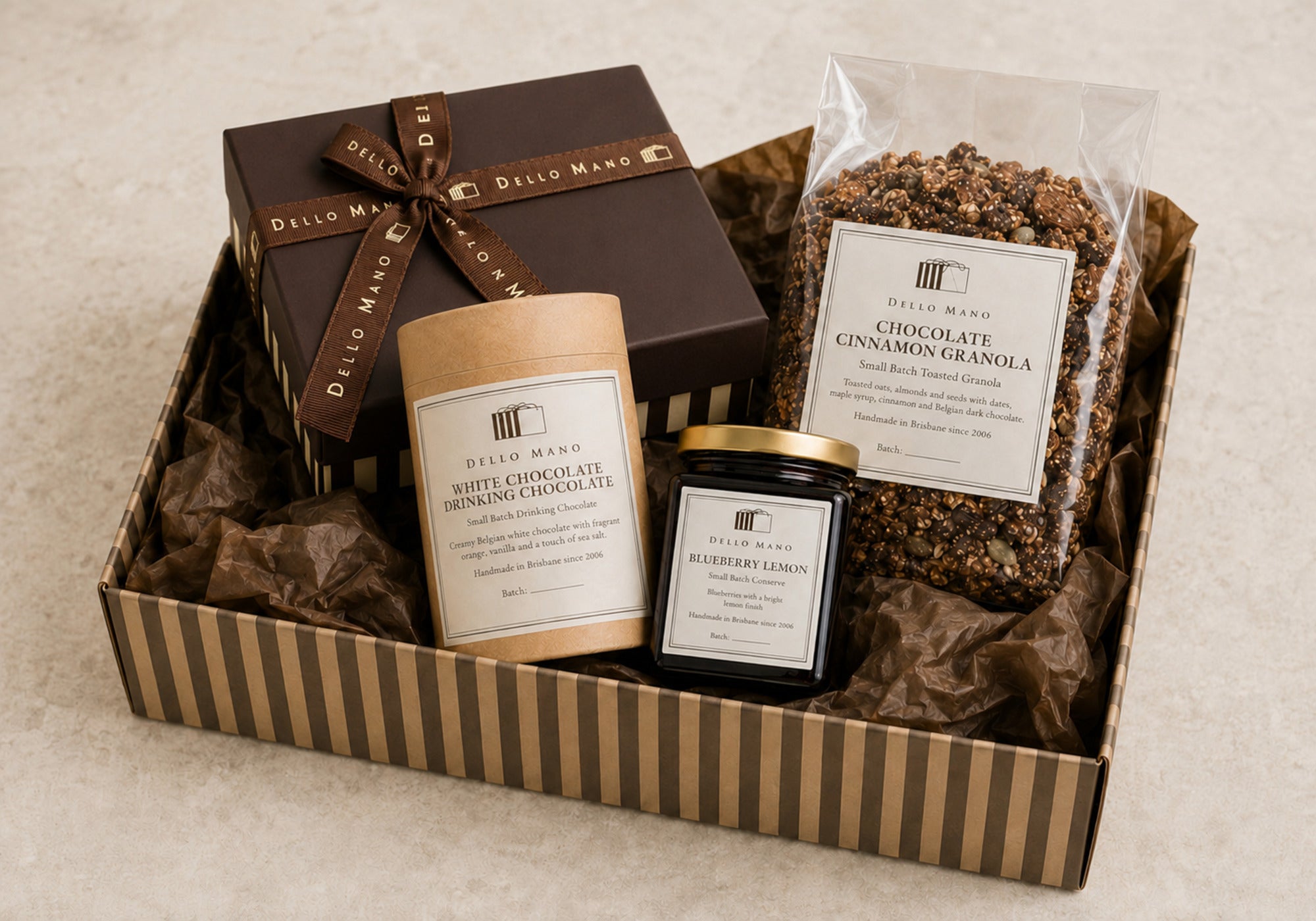 Dello Mano hamper with a brownie gift box, drinking chocolate, granola and blueberry lemon conserve, available for delivery Australia-wide.