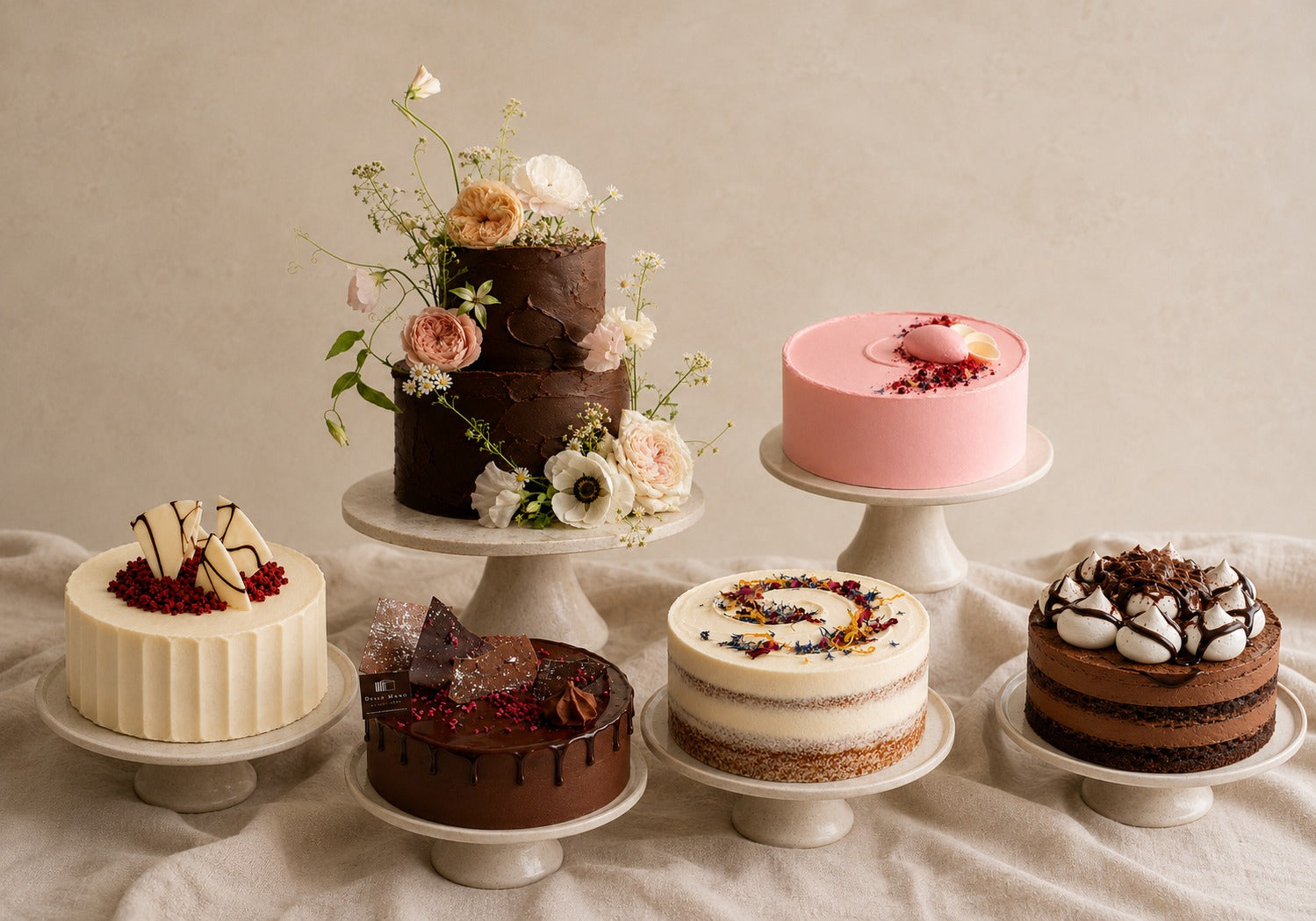 Handmade Dello Mano cakes in Brisbane, including chocolate, raspberry, red velvet and celebration cakes displayed on cake stands