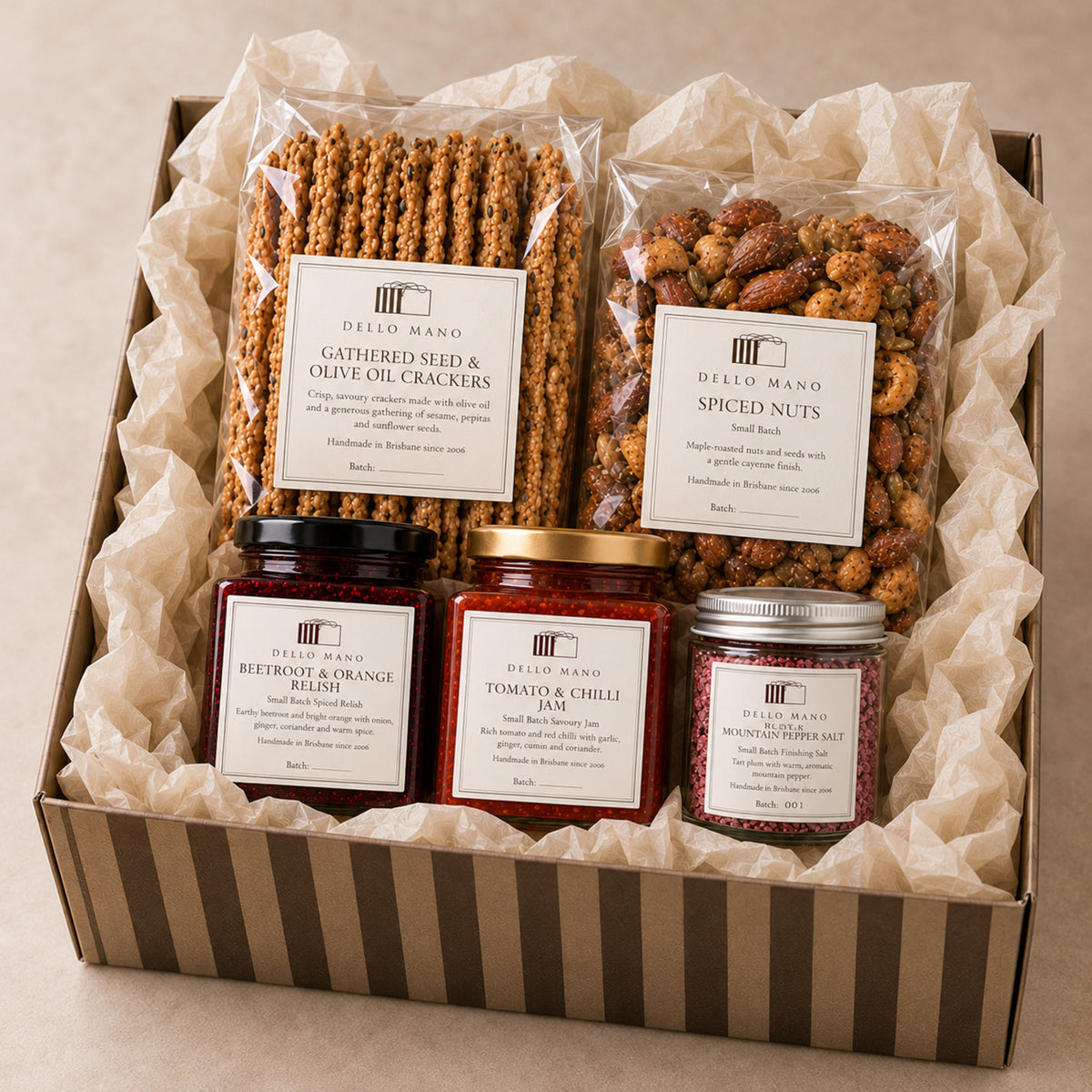 Dello Mano Just Add the Cheese Savoury Hamper packed in striped gift box with seed crackers, spiced nuts, relishes and plum mountain pepper salt.