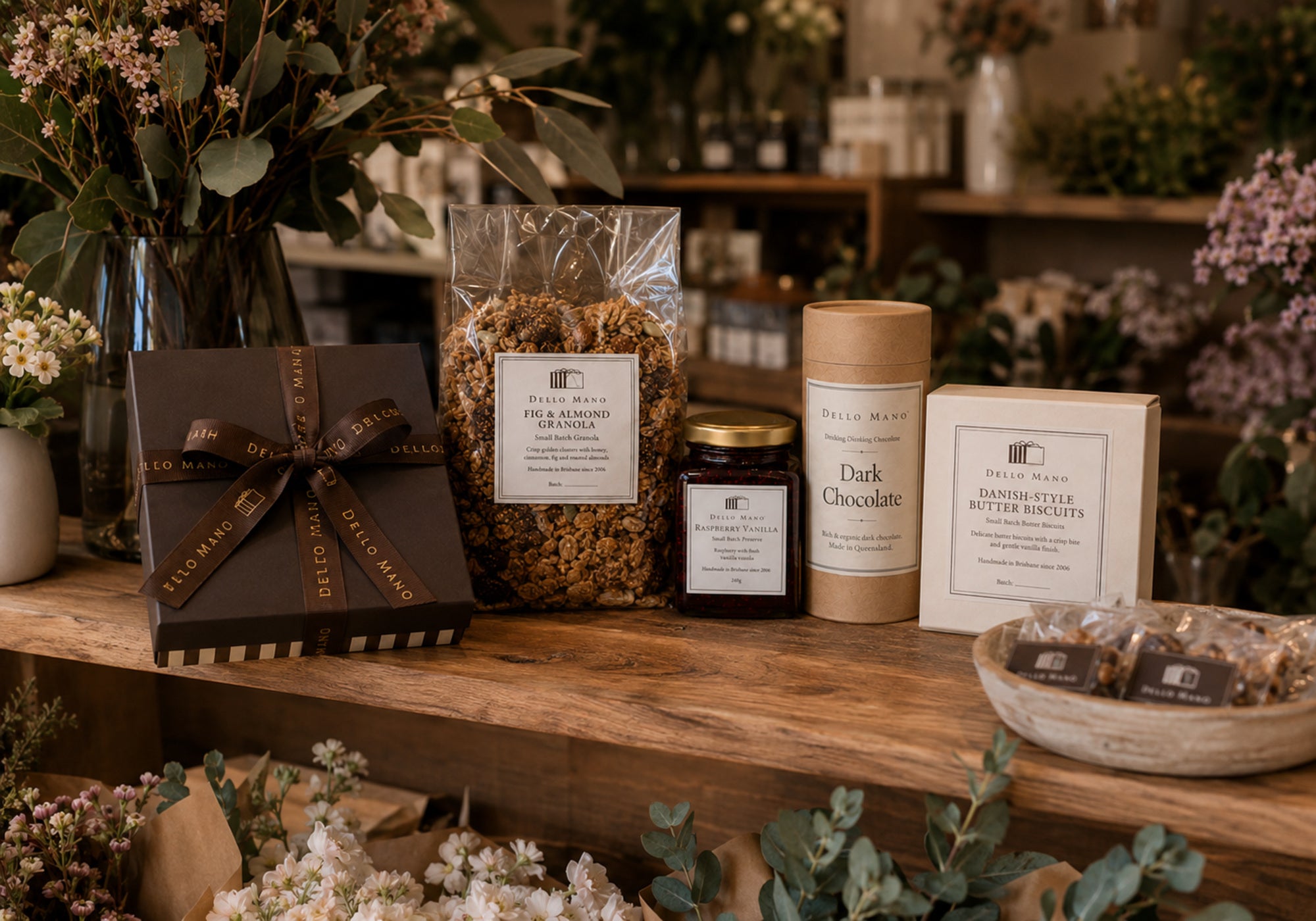 Selected Dello Mano brownies, granola, preserve, drinking chocolate and biscuits displayed in an independent florist.
