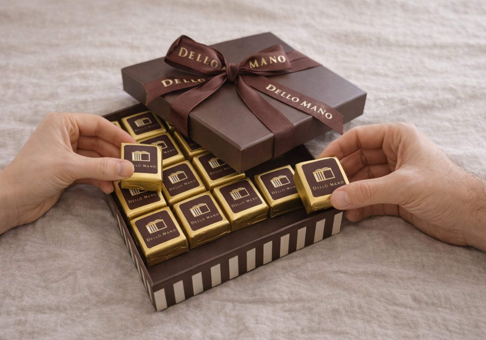 Two people sharing chocolates from an open handmade chocolate gift box, ideal for thank you gifting Australia