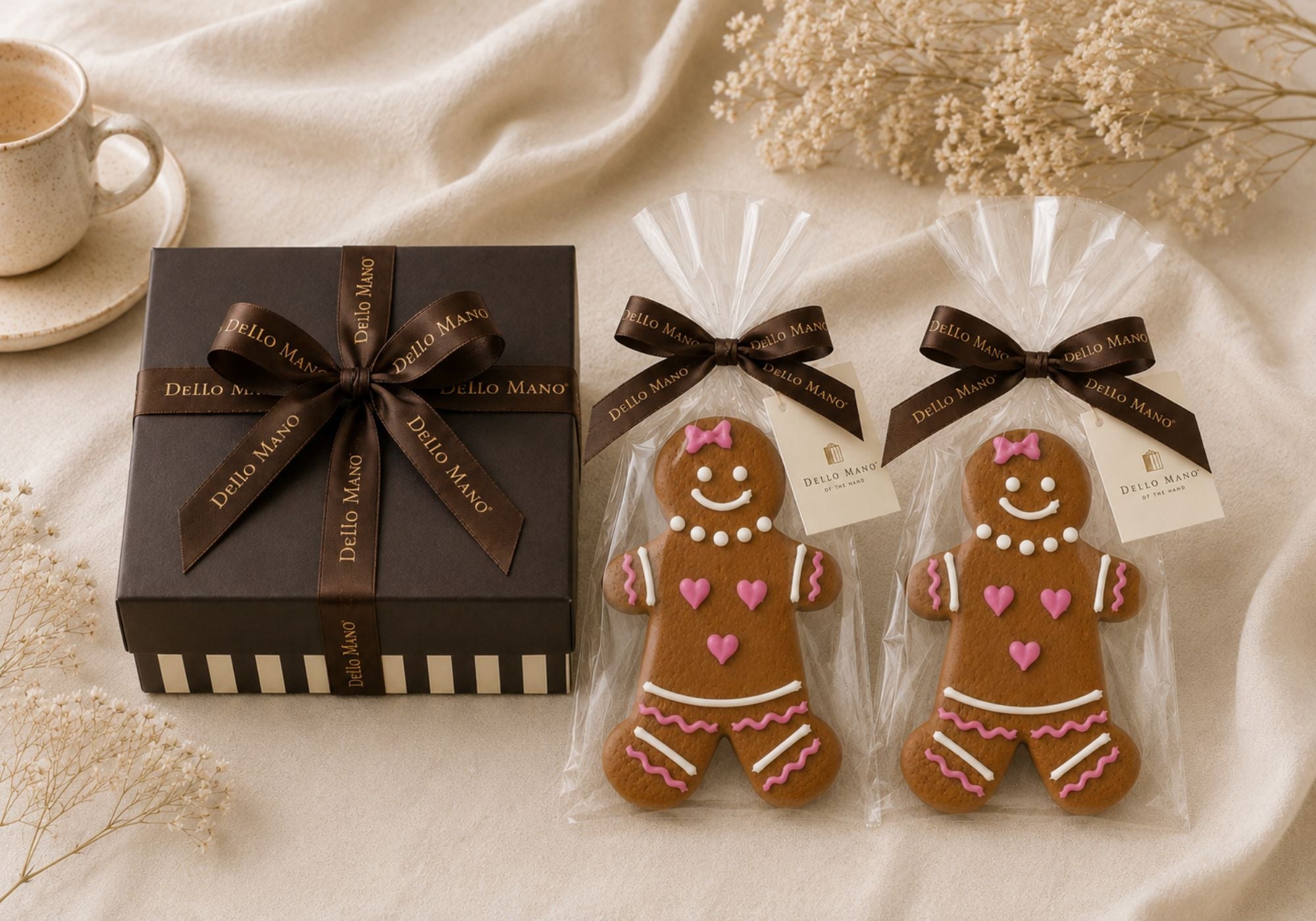 Handmade gingerbread girl cookies with luxury brownie gift box by Dello Mano, styled on linen with ribbon-wrapped packaging and gift-ready presentation.