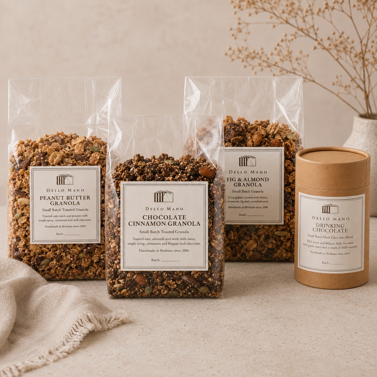 Granola Lover’s Breakfast Collection with three Dello Mano granolas and Dark Drinking Chocolate in gift-ready presentation.