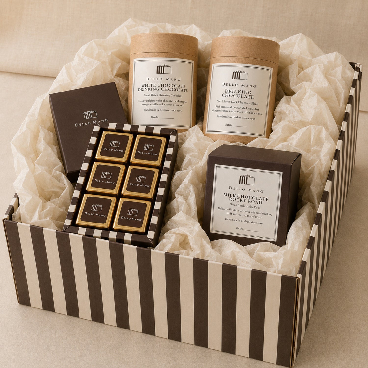  Dello Mano Chocolate Moments Hamper selection with Classic Luxury Brownies, Dark and White Drinking Chocolate and handmade Milk Chocolate Rocky Road.