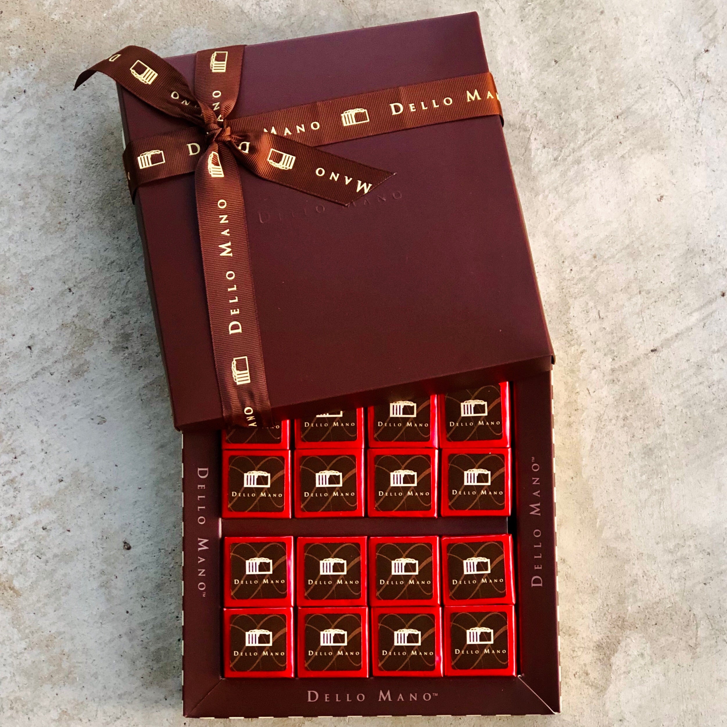 Overhead view of an open 16 piece gift box of gluten free brownies