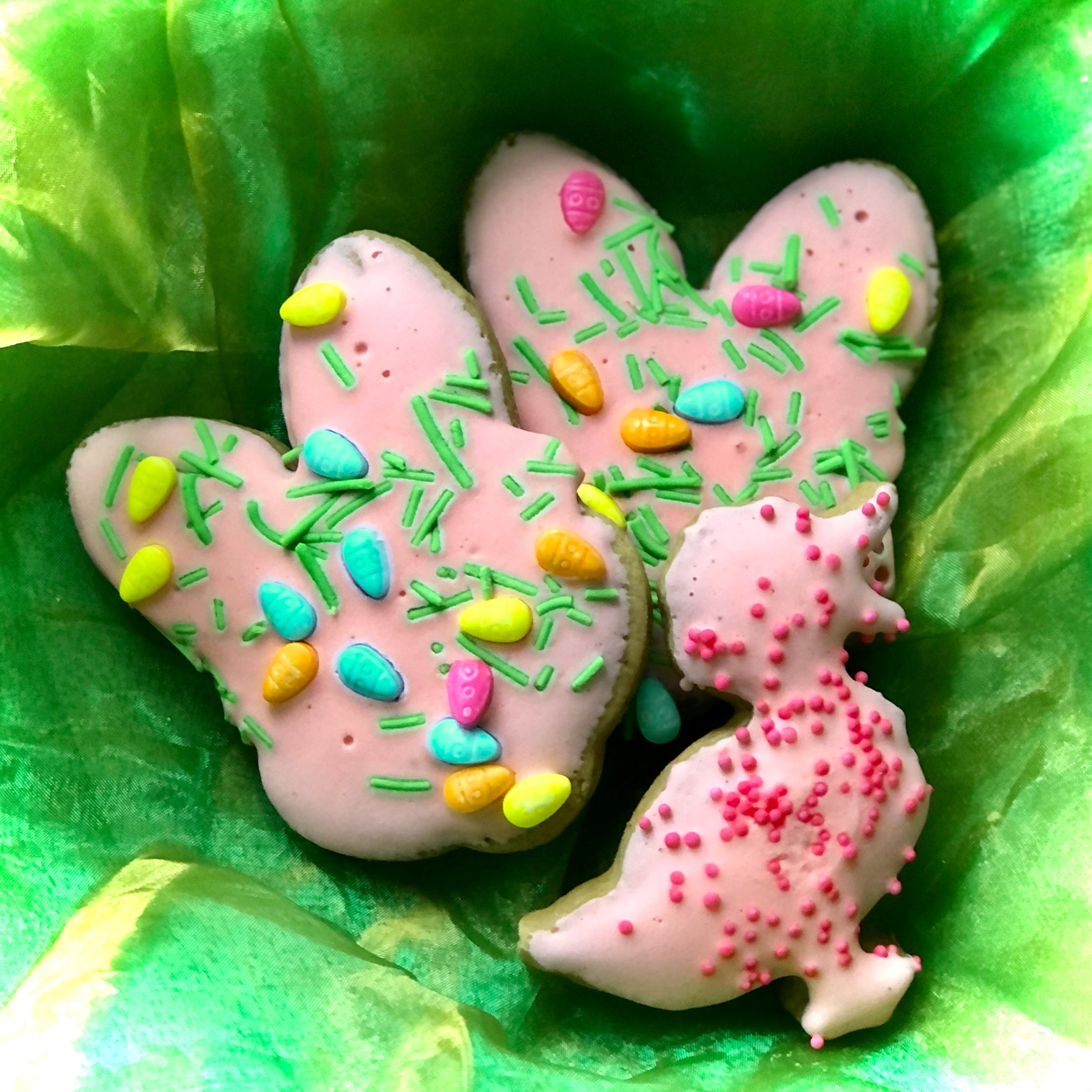 Pink Easter Cookies sitting on green fabric